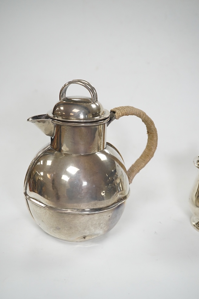 A late Victorian silver Guernsey milk can, marks rubbed, 14cm, a small silver mug and a Scottish silver kitchen pepper, Hamilton & Inches, Edinburgh, 1898, gross weight 16.4 oz. Condition - poor to fair